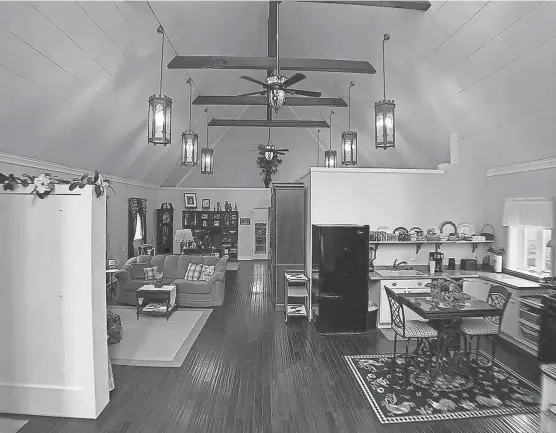  ?? SARAH COWMAN PHOTOS/HOMEFRONT REAL ESTATE ?? The living room area features wooden beams from the original church.