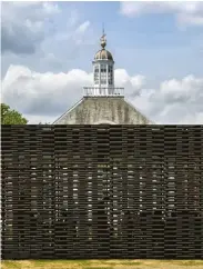  ??  ?? BELOW: For the 2018 Serpentine Pavilion, concrete roofing tiles were woven together to create a tapestry-like skin, which functioned as a dark breeze-block wall.