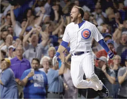  ?? AP ?? Bote celebrates as he rounds the bases after hitting a walk-off grand slam in the ninth inning last August against the Nationals.