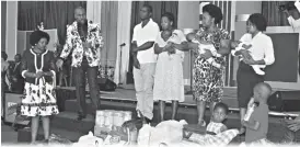  ??  ?? The founder and leader of Eagle Life Assembly Church Dr Prophet Blessing Samuel Chiza and his wife Prophetess Tatiana Chiza present a donation to Mr Philip Mwinde and his wife Ms Sibonginko­si Khumalo from Esigodini, last Sunday during service at ZITF