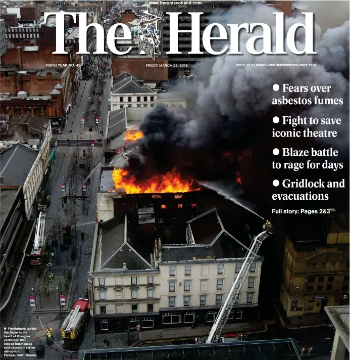  ??  ?? „ Firefighte­rs tackle the blaze in the heart of Glasgow yesterday that closed businesses and caused massive disruption.
Picture: Colin Mearns