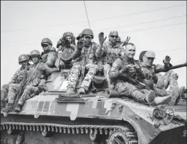  ?? ?? Ukrainian servicemen ride BMP-1 infantry fighting vehicle, amid Russia's attack on Ukraine, in Donetsk region, Ukraine June 14, 2022. REUTERS/Gleb Garanich