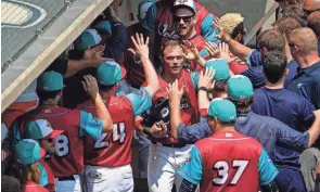  ?? ADAM CAIRNS/COLUMBUS DISPATCH ?? Alex Call of the Clippers gets high fives as he gets back to the dugout earlier this season.