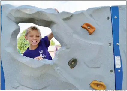  ?? TAMMY KEITH/RIVER VALLEY & OZARK EDITION ?? Jay Lemieux, 8, plays on one of the playground­s Marguerite Vann Elementary School in Conway. The school was selected as one of 24 in Arkansas for a pilot program for extended recess. Instead of 30 minutes a day for students in kindergart­en through the fourth grade, the students will get 60 minutes a day. Principal Bobby Walker said research shows that students allowed to play come back ready to focus.