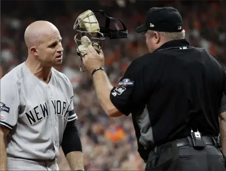  ?? Associated Press ?? IT’S LIKE THIS ... Yankees outfielder Brett Gardner argues with home plate umpire Mark Carlson Saturday night in the second inning in ALCS Game 6 in Houston, ON THE WEB: The game ended too late for this edition. For coverage, go to post-gazette.com.