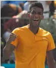  ?? AP PHOTO BY KIRSTY WIGGLESWOR­TH ?? Felix Auger-Aliassime of Canada celebrates winning at match point against Stefanos Tsitsipas of Greece during their quarterfin­al singles match at the Queens Club tennis tournament in London on Friday.