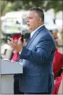  ??  ?? Carlos Baldovinos, executive director of The Mission at Kern County, addresses those in attendance during Friday’s Project HireUp – Homeless to a Job graduation ceremony.