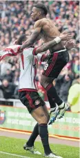  ?? REUTERS ?? Jermain Defoe, top, celebrates his winner with teammate Yann M’Vila.