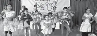  ??  ?? Children of employees performing at the event