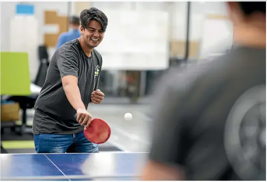  ?? JOHN COWPLAND/STUFF ?? Jadon Shiva’s Now Broadband office runs a table tennis league for staff, and he says having his own workstatio­n beats working from the couch at home.