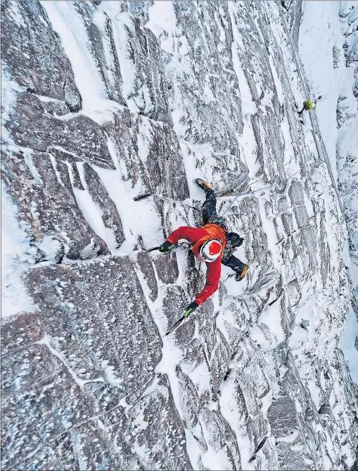  ?? ?? Adam Russell, in red, and Guy Robertson, in yellow, climb the Wailing Wall IX 9 route on An Teallach, north-west Highlands