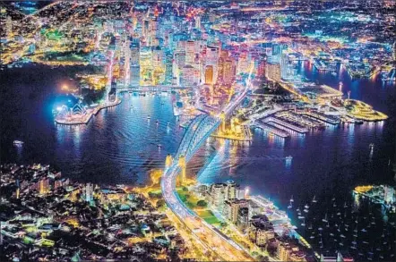  ??  ?? THE ESSENCE
of Sydney is captured by French American photograph­er Vincent Laforet in a nighttime aerial image of the city.