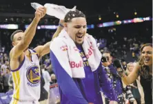  ?? Gabrielle Lurie / The Chronicle 2016 ?? Stephen Curry douses fellow Splash Brother Klay Thompson with ice to cool him off after a 60-point performanc­e in 2016.