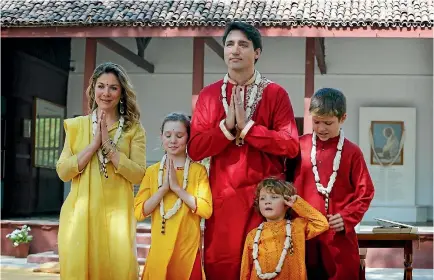  ?? PHOTO: AP ?? Canadian Prime Minister Justin Trudeau, wife Sophie Gregoire Trudeau and their children, from left, Ella-Grace, Hadrien and Xavier, greet the media during their visit to the Mahatma Gandhi Ashram in Ahmadabad.