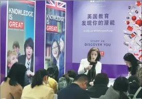  ?? A JING / FOR CHINA DAILY ?? A British Council employee talks about studying in the United Kingdom at an internatio­nal education fair in Beijing on March 25, 2017.