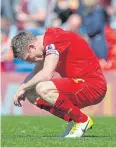  ?? EPA ?? Liverpool’s James Milner reacts after the final whistle.