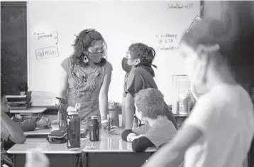  ?? MATT ROURKE/AP ?? Student teacher Olivia Vazquez, left, is finishing up her degree. The 27-year-old hopes to ensure that immigrant students arriving in Philadelph­ia have a more supportive experience in school than she did while growing up.