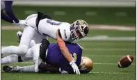  ??  ?? Arkansas Democrat-Gazette/THOMAS METTHE Booneville cornerback Ethan Dobbs knocks the ball away from Osceola receiver Greg Hooks. The Bearcats held the Seminoles to 152 total yards, 269 yards below their per-game average entering the game.