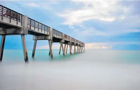  ??  ?? Greg Wareheim is this week’s winner with his shot of a pier heading into the horizon. He used a Nikon D3000, a 3.0 neutral density filter and a 94-second exposure to photograph the Vero Beach, Fla., pier. The filter darkens the image and allows for a...