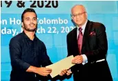  ?? ?? The Denzil Peiris Young Reporter of the Year (2019): Buddhika Gayan Samaraweer­a of Ceylon Today receives the certificat­e of merit from Kumar Nadesan