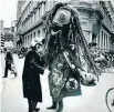  ??  ?? Officer Mike Fairweathe­r meets a monster during the inaugural festival parade in 1986.