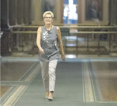  ?? STAN BEHAL / POSTMEDIA NEWS FILES ?? The Ontario government’s plan to increase the minimum wage to $15 by Jan. 1, 2019, has helped to propel Premier Kathleen Wynne’s approval rating, which is getting closer to the 20 per cent mark.