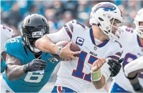  ?? DON JUAN MOORE GETTY IMAGES ?? Bills quarterbac­k Josh Allen has a 91.6 passer rating for the first quarter, while Buffalo has limited opposing quarterbac­ks to a 35.4 passer rating in the same quarter.