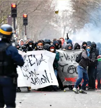  ?? Photo: Getty Images ?? Students face riot police during a demonstrat­ion yesterday in Paris as part of a nationwide day of protest against the French president’s reform drive.