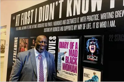  ?? RODNEY HO/RHO@AJC.COM ?? Harold Young, executive director of the Tubman African American Museum in Macon, made the Tyler Perry exhibit at his museum happen due to his persistenc­e. Reading Perry’s 2017 autobiogra­phy, “Higher Is Waiting,” led him to the idea.