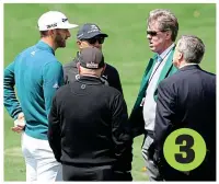  ?? GETTY IMAGES ?? Decision time: Johnson holds his back as he tells the Augusta officials he can’t carry on