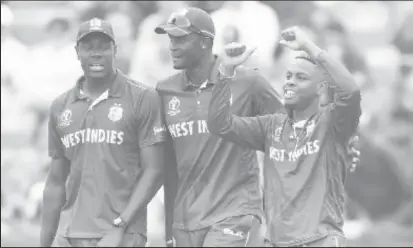  ??  ?? West Indies captain Jason Holder (centre) celebrates a wicket on Thursday with Carlos Brathwaite (left) and Shimron Hetmyer.