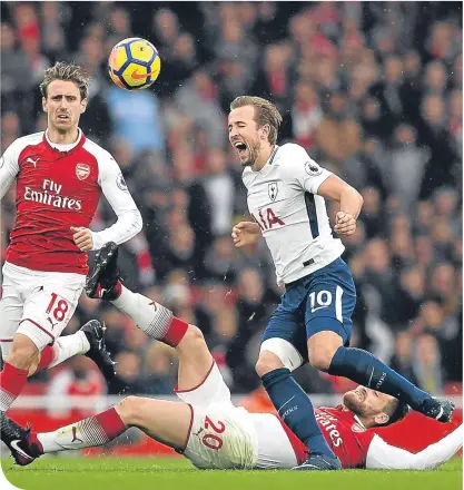  ??  ?? MESUT OZIL played 180 minutes for Germany over the last week, but appeared one of the freshest players on the field. He set up the opening goal and was a part of most of Arsenal’s best moves.
Harry Kane feels the force of a Shkodran Mustafi tackle, as...