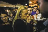  ?? Meridith Kohut / New York Times ?? A crowd greets Lilian Tintori, wife of Leopoldo Lopez, during a Caracas rally calling for his release.