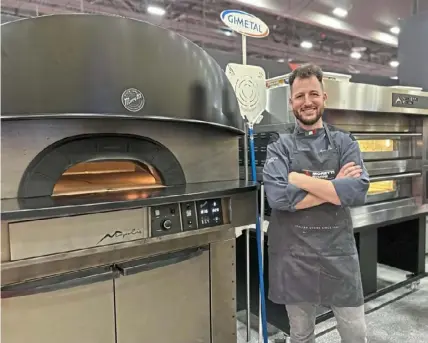  ?? Hal B. Klein/Post-Gazette photos ?? Daniele Brenci of Forno Brenci takes a break from preparing pizza in Italy-built Moretti Forni ovens in Las Vegas.