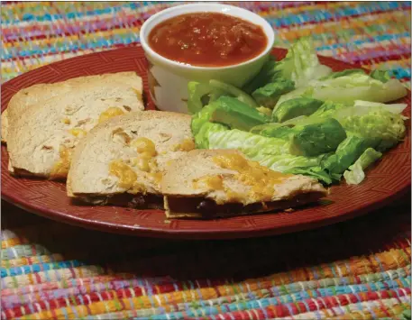  ?? LINDA GASSENHEIM­ER — TNS ?? Stacked Goat Cheese Quesadilla­s.