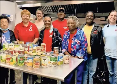  ?? Contribute­d ?? The local AARP chapter including Walter Printup (center back) donated canned food to the VAC to help feed the hungry.