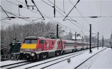  ?? ALEXANDER CROMARTY. ?? At a wintry Durham on December 29 2017, Virgin Trains East Coast 91129 propels a Newcastle-London King’s Cross service. Could VTEC’s ticketing policy be improved?