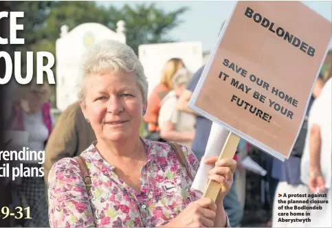  ??  ?? > A protest against the planned closure of the Bodlondeb care home in Aberystwyt­h