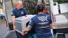  ?? PHOTO COURTESY OF THE HUMANE SOCIETY ?? Animals are loaded onto the rescue rig in Charleston, S.C., to prepare for transport up to Maryland to be placed with emergency placement partners during Hurricane Matthew. Nine of the 57 dogs transporte­d arrived at the Tri-County Animal Shelter in...