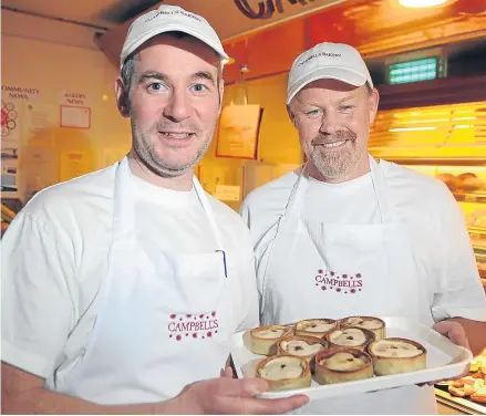  ?? Picture: Kim Cessford. ?? Mr Hall, right, is learning from Ian Campbell, left, of Campbell’s Bakery, Crieff.