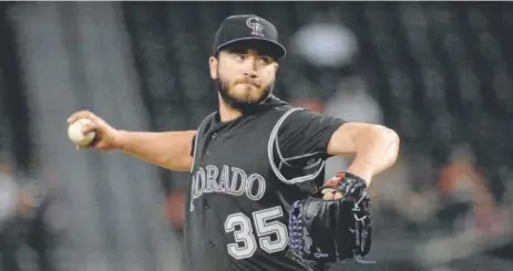  ??  ?? Rockies pitcher Chad Bettis delivers against the Arizona Diamondbac­ks on Thursday in the first inning — the only one in which he would see action. He allowed five runs on three hits and three walks in one-third of an inning.
