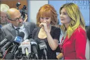  ?? AP ?? An emotional Kathy Griffin (center) speaks along with her attorneys at a news conference last month in Los Angeles. The comedian , who appeared on CNN New Year’s Eve broadcasts, was removed from that role.