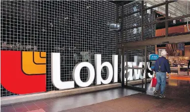  ?? VINCENT ELKAIM, THE CANADIAN PRESS ?? A shopper enters the Loblaws location on Carlton Street in Toronto.