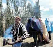  ??  ?? NEW BEGINNINGS: Chief Johannes Opperman leads the new senior headmen and the new headmen out of the kraal after they concluded the !Nau ritual formalitie­s