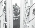  ?? GEOFF ROBINS/AFP/GETTY IMAGES ?? A girl who crossed the U.S.-Canada border is held in a detention center in Quebec.