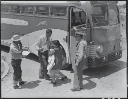  ?? STOCKTON RECORD FILE PHOTOGRAPH ?? A young Japanese-American mother and her baby are the last to leave the bus arriving at the Japanese War Relocation Center at the San Joaquin County Fairground­s in Stockton on May 19, 1942.