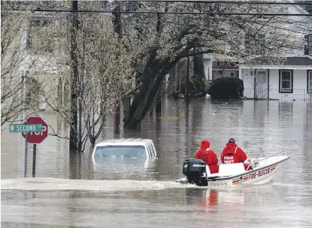  ?? MICHAEL NAGLE/GETTY IMAGES FILES ?? U.S. President Donald Trump issued an executive order to pave the way for the approvals of infrastruc­ture projects, revoking Obama-era standards requiring that builders factor in the risk of increased flooding due to climate change. Trump said the...