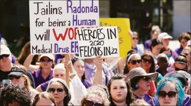  ?? Mark Humphrey / Associated Press ?? People demonstrat­e outside the courthouse where the sentencing hearing for former nurse RaDonda Vaught is being held Friday in Nashville, Tenn. Vaught was found guilty of criminally negligent homicide in the death of a patient in March after she accidental­ly administer­ed the wrong medication.