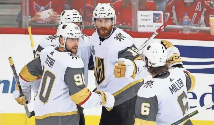  ?? AMBER SEARLS, USA TODAY SPORTS ?? James Neal (18) celebrates with his Golden Knights teammates after scoring in Game 4.