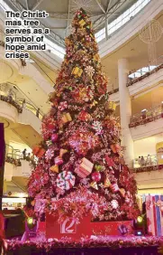  ??  ?? The Christmas tree serves as a symbol of hope amid crises